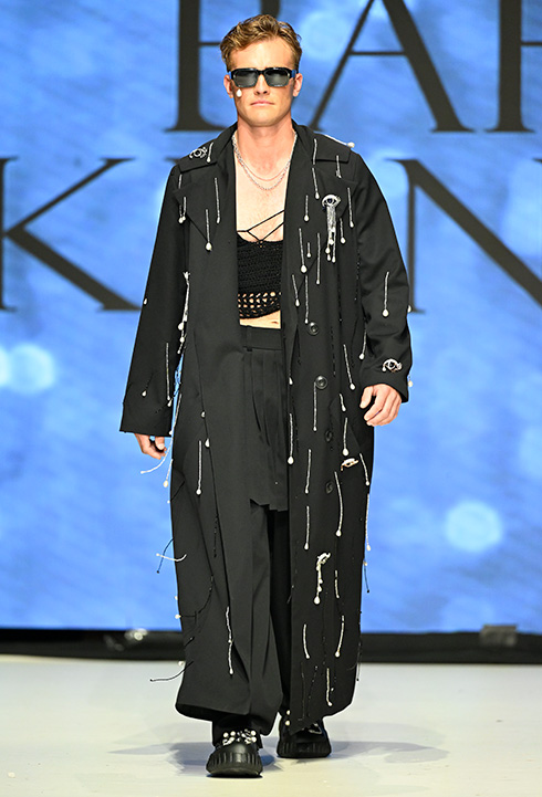 A Caucasian male model wearing black garment designed by Bahar Kianpour at Vancouver Fashion Week 2024