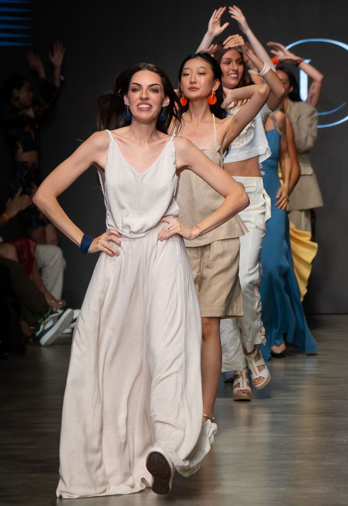 Fashion School Student Carol Botelho walks the Vancouver Fashion Week runway with her models.